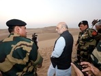 Union Home Minister Amit Shah with Border Security Force (BSF) personnel during his visit to Rohitash Border Out Post (BOP), in Jaisalmer.(ANI) Union Home Minister Amit Shah with Border Security Force (BSF) personnel during his visit to Rohitash Border Out Post (BOP), in Jaisalmer.(ANI)