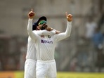 Indian captain Virat Kohli celebrates the wicket of New Zealand batter Will Young during the 2nd day of the 2nd test match between India and New Zealand, at Wankhede stadium in Mumbai, Saturday, Dec. 4, 2021.