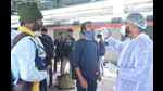In the wake of Omicron scare, BMC health worker collects a swab sample of a passenger for COVID-19 test, at Dadar Station in Mumbai, India, on Sunday (Anshuman Poyrekar) In the wake of Omicron scare, BMC health worker collects a swab sample of a passenger for COVID-19 test, at Dadar Station in Mumbai, India, on Sunday (Anshuman Poyrekar)