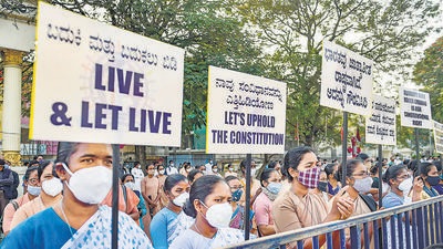 Members of the Christian community participate in a silent protest against the Anti-Conversion bill proposed in the Winter Session of Karnataka Legislative Assembly, in Bengaluru on Saturday. (PTI) Members of the Christian community participate in a silent protest against the Anti-Conversion bill proposed in the Winter Session of Karnataka Legislative Assembly, in Bengaluru on Saturday. (PTI)
