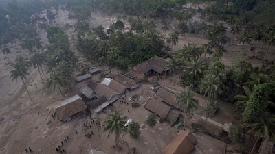 An aerial view shows houses covered in volcanic ash after the eruption of Mount Semeru hit Sumber Wuluh Village, Lumajang, East Java province, Indonesia (REUTERS) An aerial view shows houses covered in volcanic ash after the eruption of Mount Semeru hit Sumber Wuluh Village, Lumajang, East Java province, Indonesia (REUTERS)