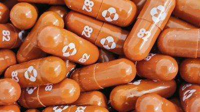 Merck’s antiviral pill was found to be 30% effective at reducing risk of hospitalization and death in high-risk people. (Reuters)