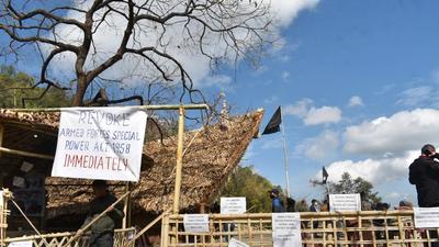 Placards and black flag are put up at the venue of Hornbill festival in solidarity with the civilians, killed in an anti-insurgency operation, in Kisama in Nagaland, on Sunday. (PTI) Placards and black flag are put up at the venue of Hornbill festival in solidarity with the civilians, killed in an anti-insurgency operation, in Kisama in Nagaland, on Sunday. (PTI)