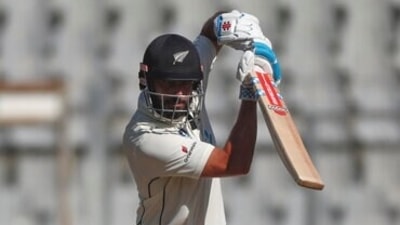 New Zealand's Daryl Mitchell plays a shot during the day three of their second test cricket match with India in Mumbai, India, Sunday, Dec. 5, 2021.(AP Photo/Rafiq Maqbool) (AP) New Zealand's Daryl Mitchell plays a shot during the day three of their second test cricket match with India in Mumbai, India, Sunday, Dec. 5, 2021.(AP Photo/Rafiq Maqbool) (AP)