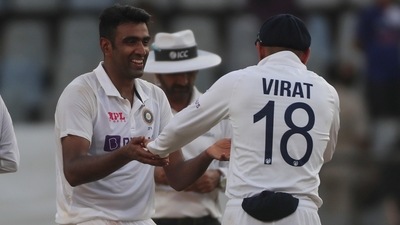 India's Ravichandaran Ashwin, left, share a light moment with Virat Kohli during the day three of their second test cricket match with New Zealand in Mumbai, India, Sunday, Dec. 5, 2021.(AP Photo/Rafiq Maqbool) (AP) India's Ravichandaran Ashwin, left, share a light moment with Virat Kohli during the day three of their second test cricket match with New Zealand in Mumbai, India, Sunday, Dec. 5, 2021.(AP Photo/Rafiq Maqbool) (AP)