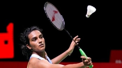 India's Pusarla V. Sindhu competes against South Korea's An Se-young during their women's singles badminton final match at the BWF World Tour Finals in Nusa Dua, Bali, Indonesia, Sunday, Dec. 5, 2021.&nbsp; (AP)