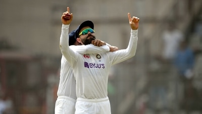 Indian captain Virat Kohli celebrates the wicket of New Zealand batter Will Young during the 2nd day of the 2nd test match between India and New Zealand, at Wankhede stadium in Mumbai, Saturday, Dec. 4, 2021. (PTI)