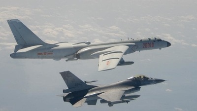 A Taiwanese F-16 fighter jet flying next to a Chinese H-6 bomber (top) off the coast of Taiwan. (AFP / File) A Taiwanese F-16 fighter jet flying next to a Chinese H-6 bomber (top) off the coast of Taiwan. (AFP / File)