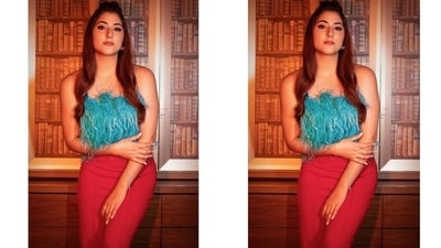 Disha chose a turquoise blue strapless top featuring faux fur tassels, a cropped length and a fitted silhouette for the photoshoot. The actor teamed the top with high waist bright red pants carrying a bodycon fit. (Instagram/@dishaparmar) Disha chose a turquoise blue strapless top featuring faux fur tassels, a cropped length and a fitted silhouette for the photoshoot. The actor teamed the top with high waist bright red pants carrying a bodycon fit. (Instagram/@dishaparmar)