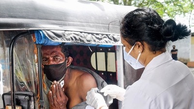 A beneficiary receives a dose of Covid-19 vaccine at a drive-in vaccination centre in Thiruvananthapuram. (PTI)