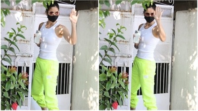 Katrina chose a simple solid white tank top featuring a scooped neckline and body-hugging fit. The Sooryavanshi actor teamed the top with stylish neon green coloured joggers with a gathered hem and baggy fit. (HT Photo/Varinder Chawla) Katrina chose a simple solid white tank top featuring a scooped neckline and body-hugging fit. The Sooryavanshi actor teamed the top with stylish neon green coloured joggers with a gathered hem and baggy fit. (HT Photo/Varinder Chawla)