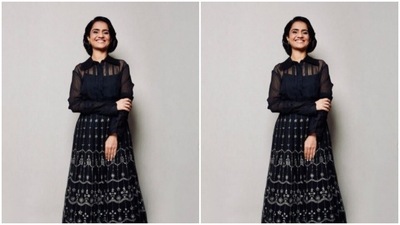 Amruta's black shirt came with collars and dramatic frills near the cuffs. (Instagram/@amrutasubhash)