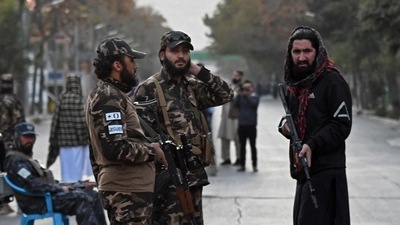 Taliban fighters stand guard near a military hospital in Kabul. (AFP) Taliban fighters stand guard near a military hospital in Kabul. (AFP)