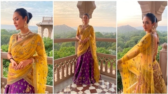 Esha Gupta had earlier made jaws drop when she posed from a picturesque location in Jaipur in a traditional yellow and purple lehenga.(Instagram/@egupta)