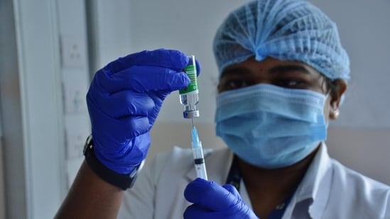 Health worker filling a syringe with Covishield vaccine dose. (HT FILE PHOTO)