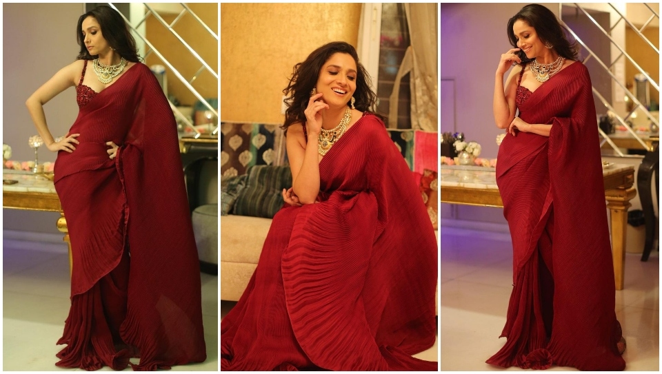 Ankita Lokhande in a wide-red saree.