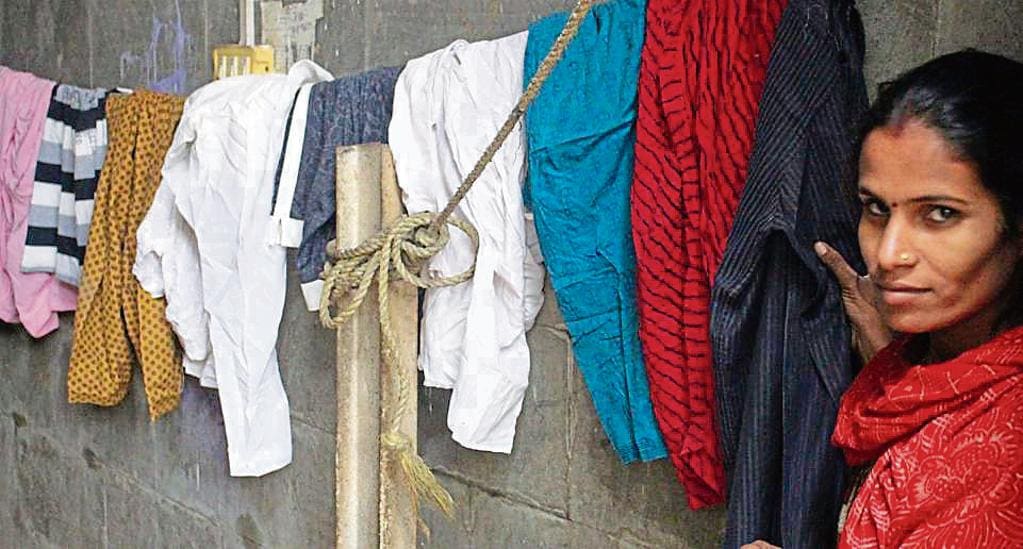 The underprivileged can pick up anything that’s donated here. One such wall in Janakpuri provides a number of options in clothes. (Photo: Siddhi Jain/HT)