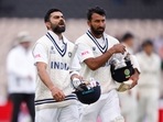 India's Virat Kohli and Cheteshwar Pujara&nbsp;