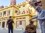 A healthcare worker collects a swab sample of a man for the Covid-19 test at Birla Mandir amid the threat of new Covid-19 variant Omicron, in New Delhi.(HT Photo) A healthcare worker collects a swab sample of a man for the Covid-19 test at Birla Mandir amid the threat of new Covid-19 variant Omicron, in New Delhi.(HT Photo)