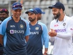 Indian team captain Virat Kohli with head coach Rahul Dravid after their victory in the 2-match test cricket series against New Zealand, at Wankhede stadium in Mumbai, Monday, Dec. 6, 2021
