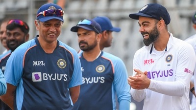 Indian team captain Virat Kohli with head coach Rahul Dravid after their victory in the 2-match test cricket series against New Zealand, at Wankhede stadium in Mumbai, Monday, Dec. 6, 2021 (PTI)