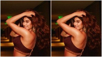 Janhvi decked up in gold eyeshadow, mascara-laden eyelashes, black eyeliner, black kohl, drawn eyebrows, contoured cheeks and a shade of soft maroon lipstick. (Instagram/@janhvikapoor)