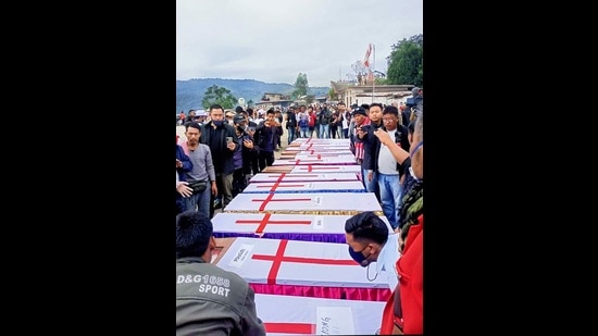 Relatives and locals during the funeral of the 13 people who were allegedly killed by Armed Forces, in Mon district, Monday. (PTI) Relatives and locals during the funeral of the 13 people who were allegedly killed by Armed Forces, in Mon district, Monday. (PTI)