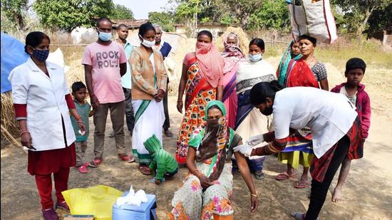 A woman receives a dose of Covid vaccine during a door-to-door vaccination campaign at Bogai Bera Panchayat, in Ranchi on Monday. (ANI)