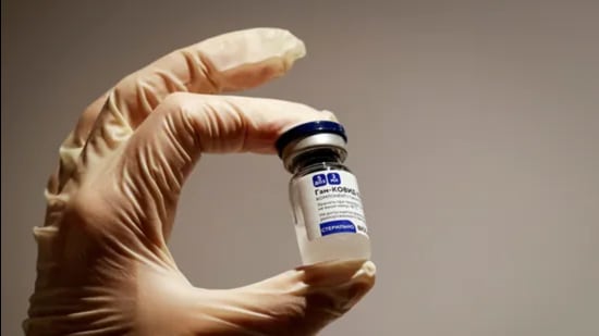 A medical specialist holds a vial of Sputnik V vaccine against the coronavirus in a department store in Moscow, Russia. (Reuters) A medical specialist holds a vial of Sputnik V vaccine against the coronavirus in a department store in Moscow, Russia. (Reuters)
