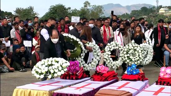 File photo: Nagaland Minister for Health and Family Welfare S Pangnyu Phom lays a wreath at the mortal remains of the civilians allegedly killed during an Assam Rifles' anti-insurgency operation in Mon district of Nagaland. (ANI)