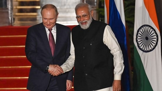 Prime Minister Narendra Modi greets Russian president Vladimir Putin before a meeting at Hyderabad House in New Delhi(AFP)