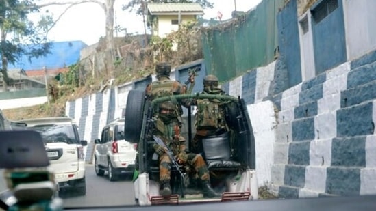 Army soldiers ride past the main town in a convoy in Kohima, capital of northeastern Nagaland state,&nbsp;(AP)