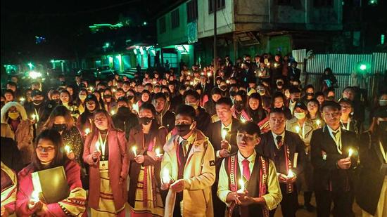 Locals participate in a candle march over the death of 13 people, who were allegedly killed by the armed forces, Mon district, December 5 (PTI)