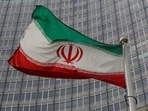 An Iranian flag flutters in front of the International Atomic Energy Agency (IAEA) headquarters in Vienna, Austria&nbsp;