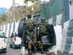 Soldiers ride past the main town in a convoy in Nagaland capital Kohima.(AP) Soldiers ride past the main town in a convoy in Nagaland capital Kohima.(AP)