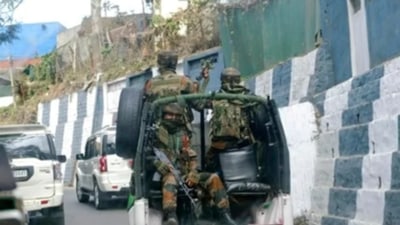 Soldiers ride past the main town in a convoy in Nagaland capital Kohima. (AP) Soldiers ride past the main town in a convoy in Nagaland capital Kohima. (AP)