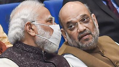 Prime Minister Narendra Modi and home minister Amit Shah at the Ambedkar International Centre in New Delhi on Tuesday. (PTI) Prime Minister Narendra Modi and home minister Amit Shah at the Ambedkar International Centre in New Delhi on Tuesday. (PTI)
