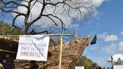 Placards and black flag are put up at the venue of Hornbill festival in solidarity with the civilians, killed in an anti-insurgency operation, in Kisama in Nagaland, on Sunday. (PTI)