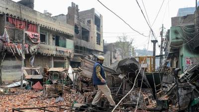 In this file photo taken in 2020, a security personnel patrols near burnt-out and damaged residential premises and shops following clashes between people supporting and opposing a contentious amendment to India's citizenship law, in New Delhi. (AFP) In this file photo taken in 2020, a security personnel patrols near burnt-out and damaged residential premises and shops following clashes between people supporting and opposing a contentious amendment to India's citizenship law, in New Delhi. (AFP)