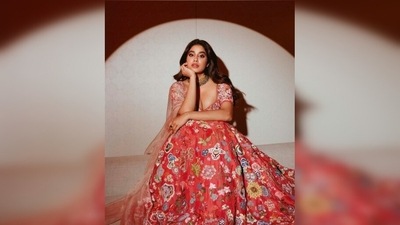 Janhvi Kapoor's outfit comprised of a blouse that featured a plunging neckline and floral embroidery, a heavy work skirt and a see-through dupatta. (Instagram/@janhvikapoor) Janhvi Kapoor's outfit comprised of a blouse that featured a plunging neckline and floral embroidery, a heavy work skirt and a see-through dupatta. (Instagram/@janhvikapoor)