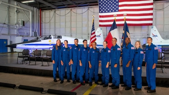 Astronaut candidates Nichole Ayers, Christina Birch, Luke Delaney, Andre Douglas, Christopher Williams, Jessica Wittner, Anil Menon, Andre Douglas, Deniz Burnham, and Marcos Berrios pose for a group photo at the NASA's 2021 Astronaut Candidate announcement event on December 6, 2021, at Ellington Field in Houston, Texas.&nbsp;(AFP)