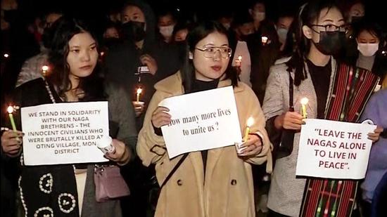 Human rights groups and student bodies from Nagaland hold a candle-light vigil in New Delhi on Monday. (ANI)