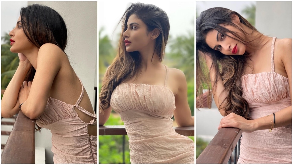 Mouni Roy pairs her dress with classic red lips.&nbsp;
