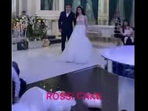 The shocked bride and groom looking at their wedding cake that seemed to have toppled over. (instagram/@rossi_cake_) The shocked bride and groom looking at their wedding cake that seemed to have toppled over. (instagram/@rossi_cake_)