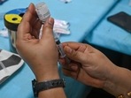 A health worker prepares a dose of Covaxin vaccine against Covid-19 coronavirus at a vaccination centre in New Delhi on September 14, 2021.(Photo by Prakash SINGH / AFP) A health worker prepares a dose of Covaxin vaccine against Covid-19 coronavirus at a vaccination centre in New Delhi on September 14, 2021.(Photo by Prakash SINGH / AFP)