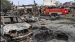 A photo taken on February 26, 2020 shows firefighters standing near a fire rescue vehicle as they douse burnt-out tyre market following deadly clashes in New Delhi. (AFP/File) A photo taken on February 26, 2020 shows firefighters standing near a fire rescue vehicle as they douse burnt-out tyre market following deadly clashes in New Delhi. (AFP/File)