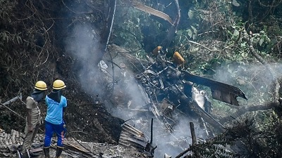 Firemen and rescue workers stand next to the debris of an IAF Mi-17V5 helicopter crash site in Coonoor, Tamil Nadu. (AFP) Firemen and rescue workers stand next to the debris of an IAF Mi-17V5 helicopter crash site in Coonoor, Tamil Nadu. (AFP)