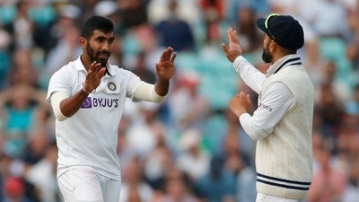 Jasprit Bumrah (L) with Virat Kohli during the England tour. (Action Images via Reuters)