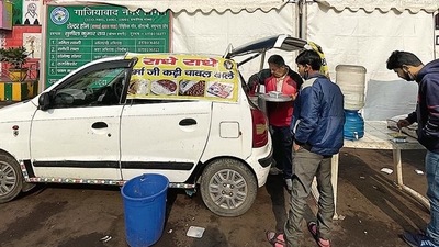 A cloth banner printed with this name is draped across the length of the cab, and it is in direct view of pedestrians here in Anand Vihar,.
