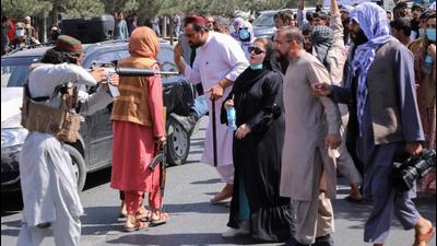 A member of the Taliban points his gun at protesters as Afghan demonstrators shout slogans during an anti-Pakistan protest, near the Pakistan embassy in Kabul earlier this year. (Image used for representation). (REUTERS PHOTO.)